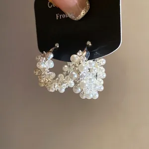 Elegant 18k gold plated hoop earrings with shimmering pearls and cubic zirconia clusters