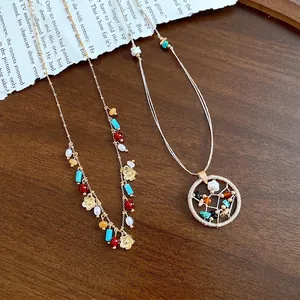 Elegant boho style beaded necklace set with hollow circular stone pendant on wooden background