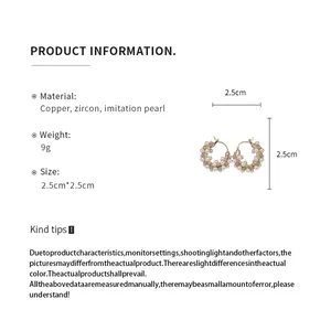Detail view of 18k gold plated pearl hoop earrings with size and material specifications.