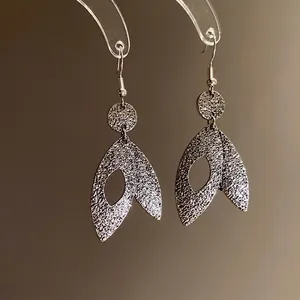 Elegant silver leaf drop earrings with sparkling textured finish for stylish women