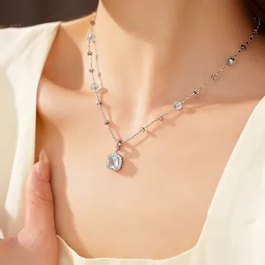 Elegant silver necklace with square light blue zircon pendant and matching glass beads