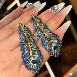Detailed shot of vintage peacock feather earrings with colorful micro-set zircons