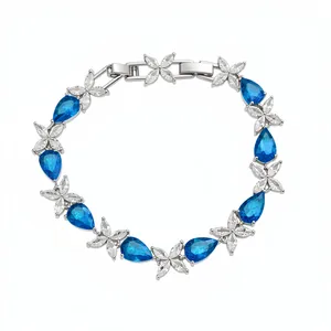 Exquisite silver-tone bracelet featuring blue water drop zircons and floral patterns