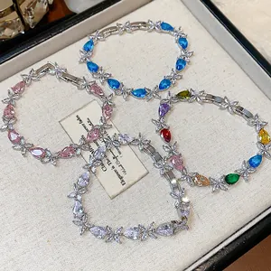 Detailed view of four zircon waterdrop flower bracelets in various vibrant colors
