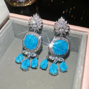 Elegant silver stud earrings with blue stones and sparkling zircon flower tassels