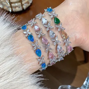Close-up of elegant teardrop and flower zircon bracelets in multiple vibrant colors