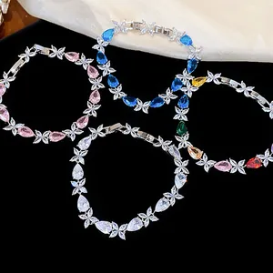 Sweet teardrop zircon flower bracelets in multiple colors on black velvet background