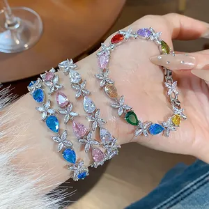 Detailed view of an elegant colorful teardrop zircon flower bracelet worn on a wrist