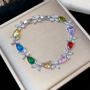 Close-up of colorful teardrop zircon bracelet with delicate flower patterns on box