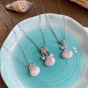 Detail view of Korean style stainless steel necklaces with pink shell pendants and zircon