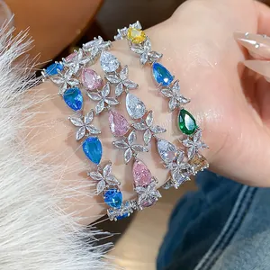 Sparkling waterdrop flower bracelet with colorful zircons worn on a female wrist detail