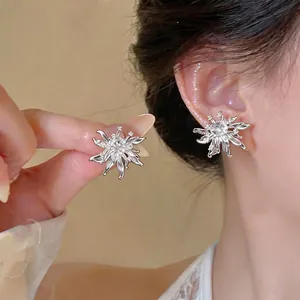 Elegant zircon flower stud earrings with a minimalist silver-tone design for women