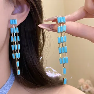 Long turquoise rectangular tassel earrings in elegant vintage court style for women.