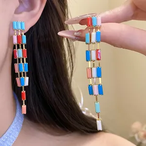 Detailed view of colorful rectangle block drop earrings in vintage palace style for women