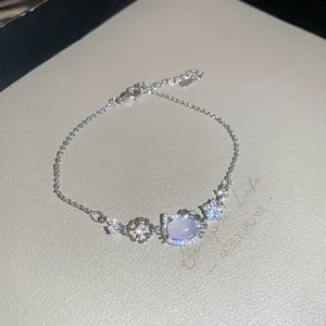 Elegant silver-toned bracelet with zircon flowers and a pink cat pendant for women
