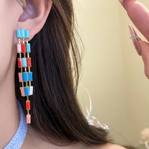 Detailed close-up of vintage multi-colored rectangular block dangle earrings for women.