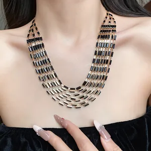 Vintage multi-layer choker necklace with rectangular black stones shown on model