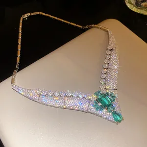 Macro view of luxurious 18k gold-plated necklace with sparkling emerald-cut zircon