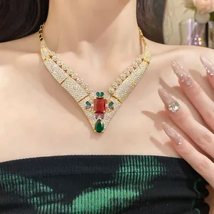 Detailed view of vintage palace style 18K gold plated necklace with red square zircon stone