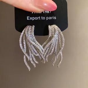 Elegant 18k gold plated silver needle zircon fringe earrings with a sparkling wing design