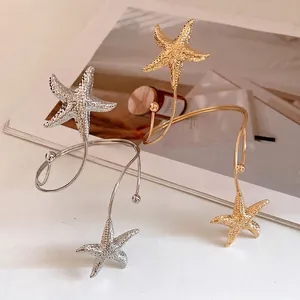 Elegant metal starfish wrap-around arm cuff bracelet in gold and silver metallic finishes