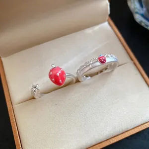 Elegant strawberry and star open ring set presented in a premium fabric-lined jewelry box