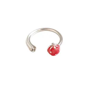 Dainty adjustable silver open ring featuring a cute red enamel strawberry and star motif