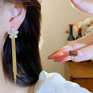Elegant gold-plated zircon flower tassel earring shown in detailed close-up view