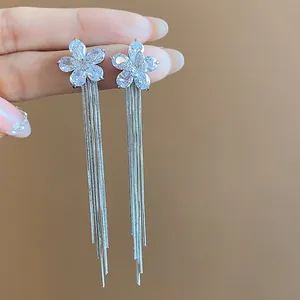 Elegant silver-plated tassel earrings featuring zircon flower design and long chain drops