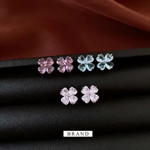 Elegant flower-shaped zircon stud earrings in pink, blue, and clear crystals