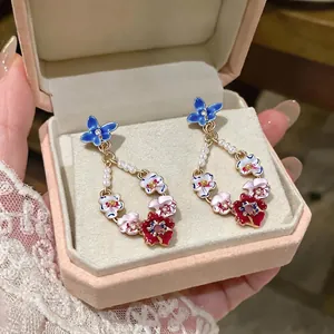 Elegant floral drop earrings with real gold plating and pearl accents in a luxury gift box