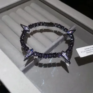 Close-up detail of a hip-hop style black panther themed zircon bracelet with spikes