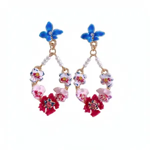 Exquisite floral drop earrings with gold plating, colorful enamel flowers, and elegant pearls