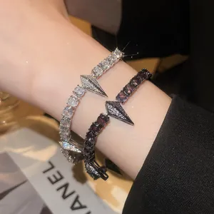Detailed close-up of punk style zircon bracelets featuring a unique geometric arrow design.
