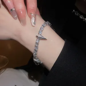 Macro view of high-quality silver zircon bracelet featuring a punk geometric spike design