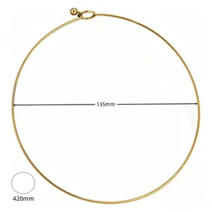 Detailed view of a minimalist gold plated stainless steel torque necklace with dimensions