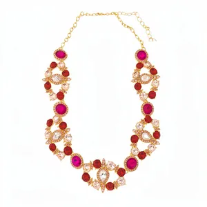 Retro court style gold necklace with red and pink crystal clusters in a bib design