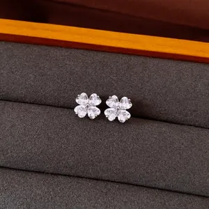 Detailed macro view of elegant flower stud earrings set with sparkling cubic zirconia stones