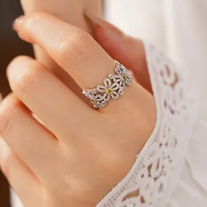 Close-up of zircon-set flower openwork ring showing its exquisite details and sparkle