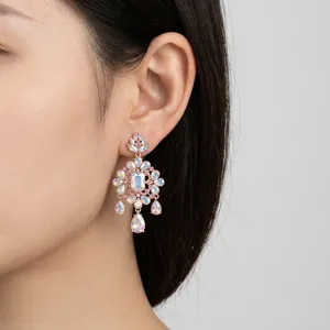 Elegant floral drop earrings with shimmering crystals and teardrop pendants for women.