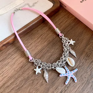 Detailed view of ocean-themed necklace with pink leather cord and starfish charms