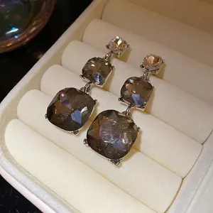Elegant vintage 3-tier smoky grey crystal drop earrings in a polished silver-tone setting