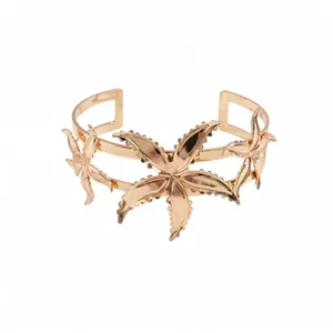 Elegant gold metallic starfish cuff bracelet with intricate lace-edge floral design.