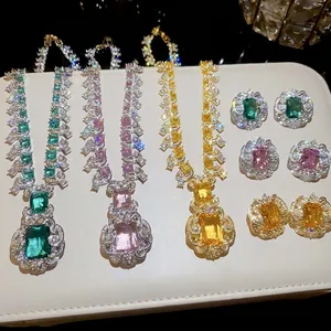 Luxury jewelry set with square zircon necklaces and matching earrings on a white pad