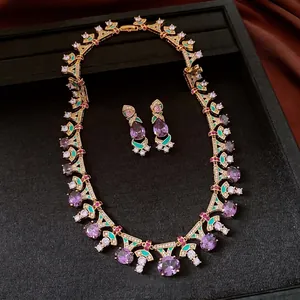 Vintage luxury necklace and earring set with purple zircon and green enamel accents