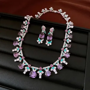 Elegant vintage silver jewelry set featuring purple oval stones and green enamel details
