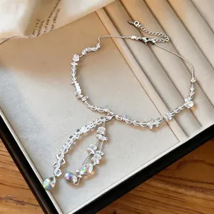 Elegant clear crystal beaded necklace with iridescent teardrop pendants for women