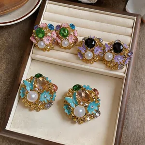 Vintage palace style earrings with floral butterfly designs and elegant pearls