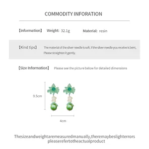 Detailed dimensions of green resin flower drop earrings showing 9.5cm height and resin material.