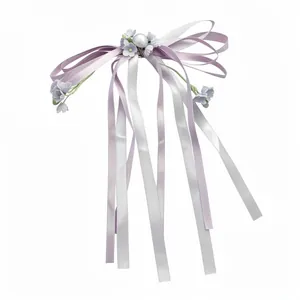 Elegant purple and silver ribbon bow hair clip with pearls and small flower accents